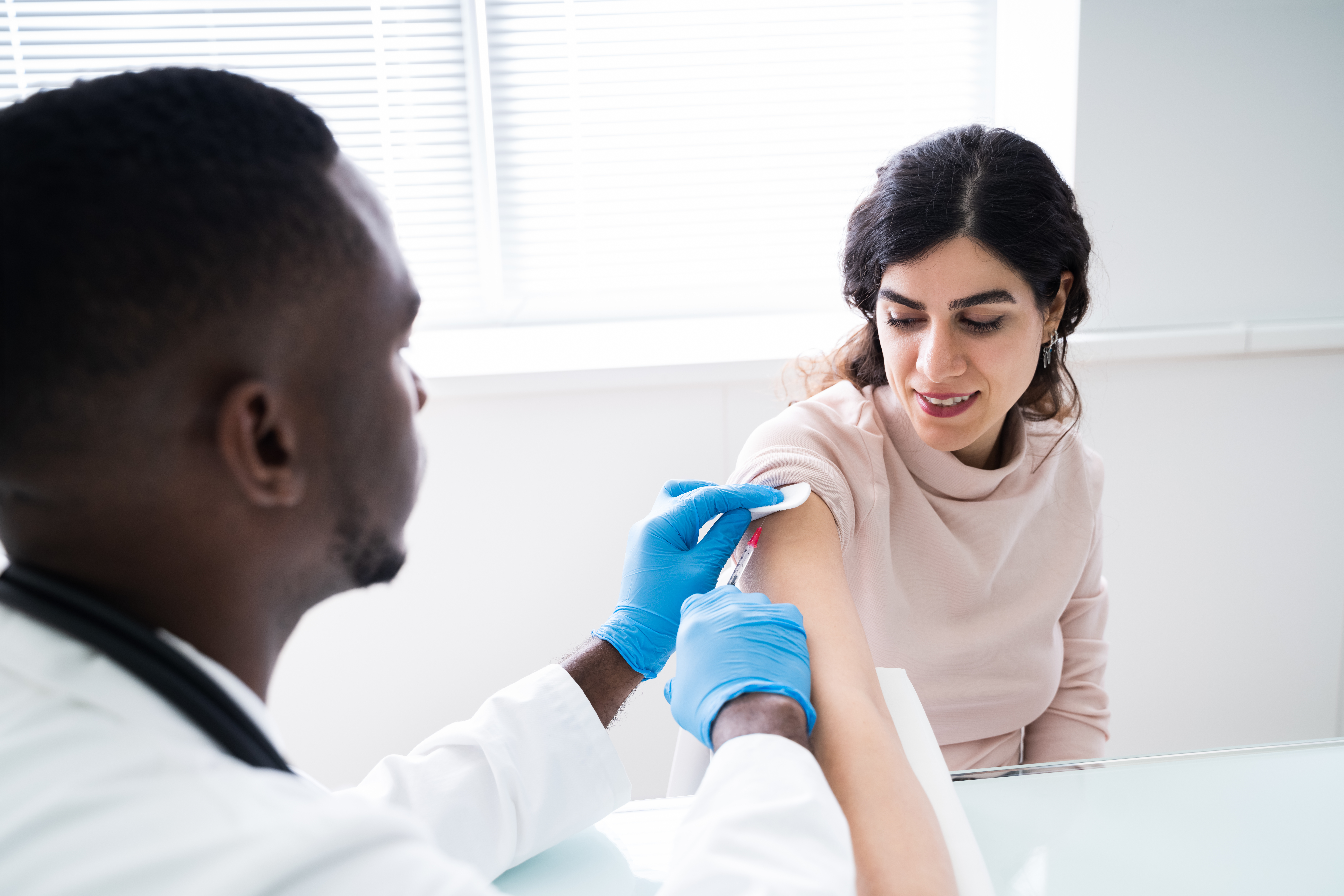 Doctor Injecting Patient With Coronavirus Vaccine
