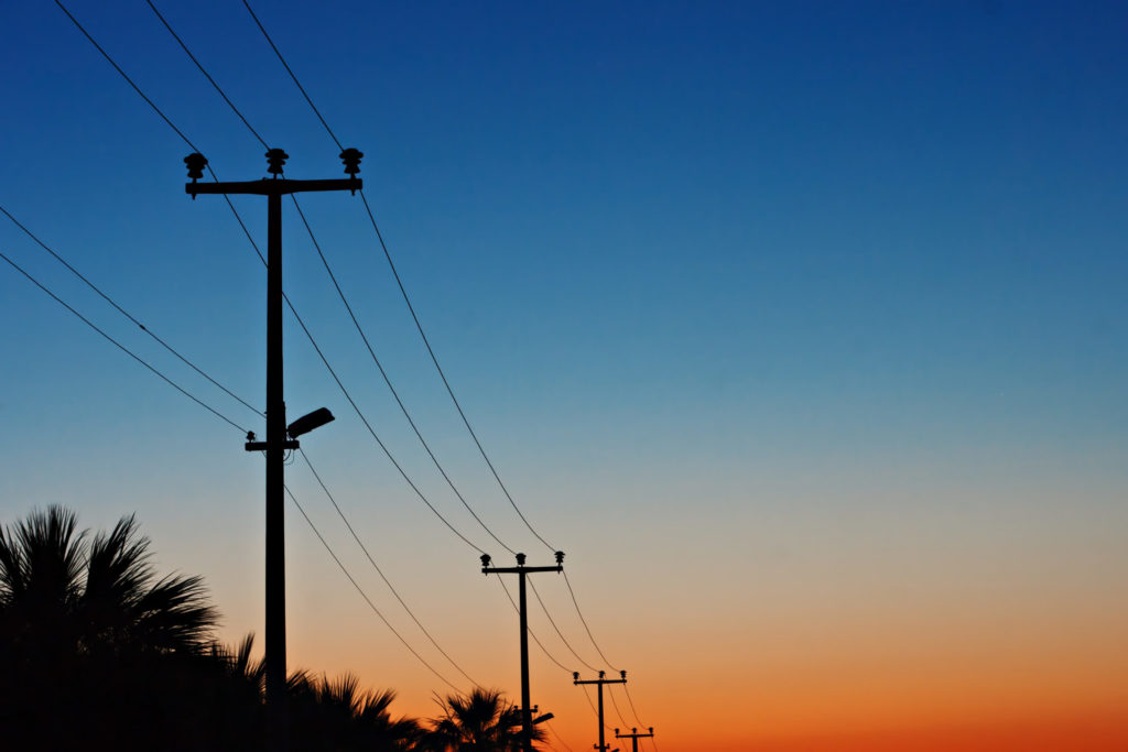 Electric power lines against a dawn sky