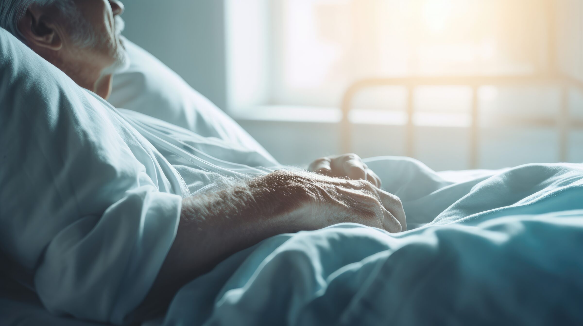 An elderly man in bed in close-up. Elderly care, hospice care. Long-term care for the elderly, rehabilitation