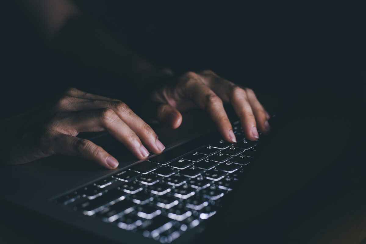 using computer.hand typing message on keyboard laptop chatting friend and search information form internet